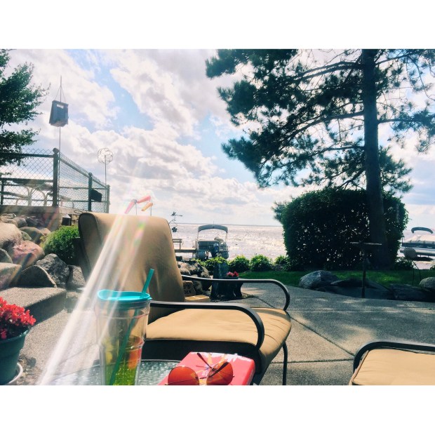 Reading, sunning and enjoying the cabin lake breeze.